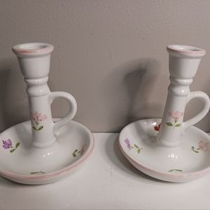 A pair of vintage floral candle holders not sure of brand made in Portugal